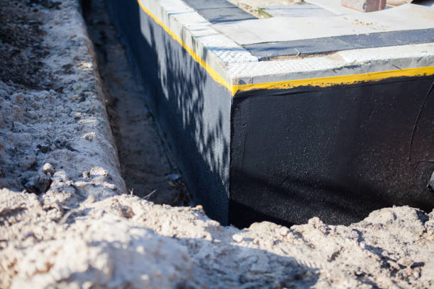 Professional Basement Waterproofing technician working in Valley City, OH